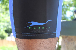 Close up of the Herron Apparel logo on the right leg of the ultra-comfortable Herron running shorts